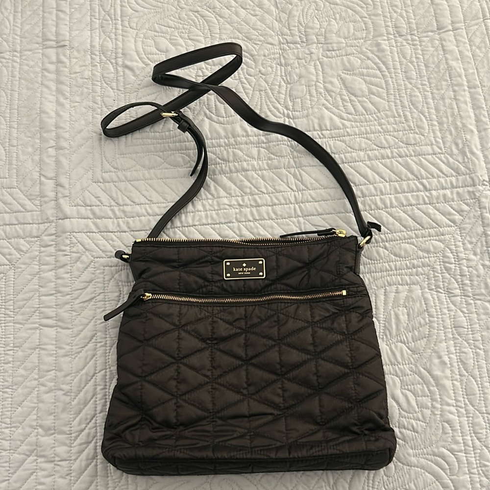 NWOT Kate Spade purse. Black quilted with gold tone hardware.